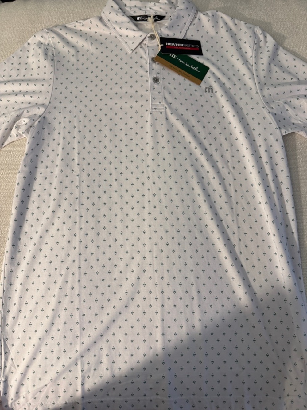 Travis Mathew White Polo with Small Green Dot Pattern